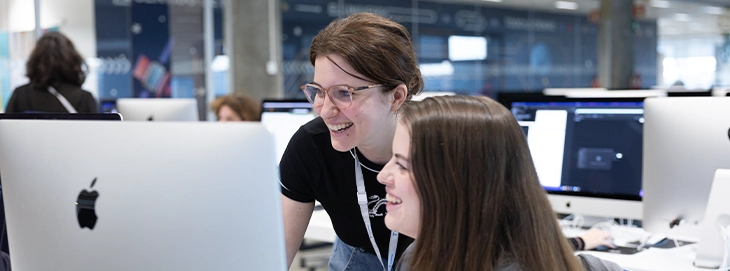 Women take part in a Piscine Discovery Women's Edition at 42 Madrid Fundación Telefónica to explore programming and digital skills.
